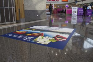 Floor advertising with custom printed floor graphics or floor decals